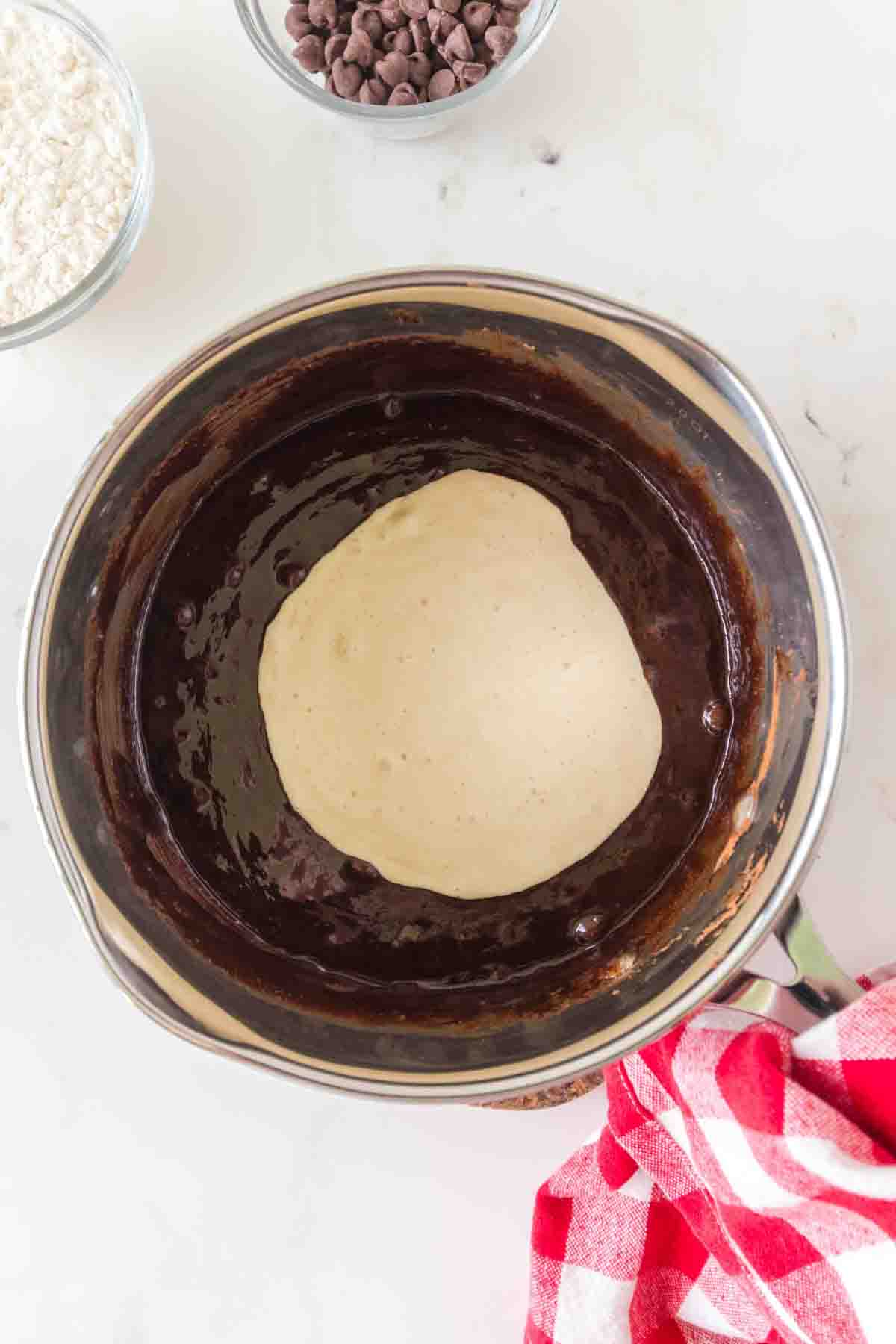 Folding sourdough discard into chocolate brownie batter. Hostess At Heart