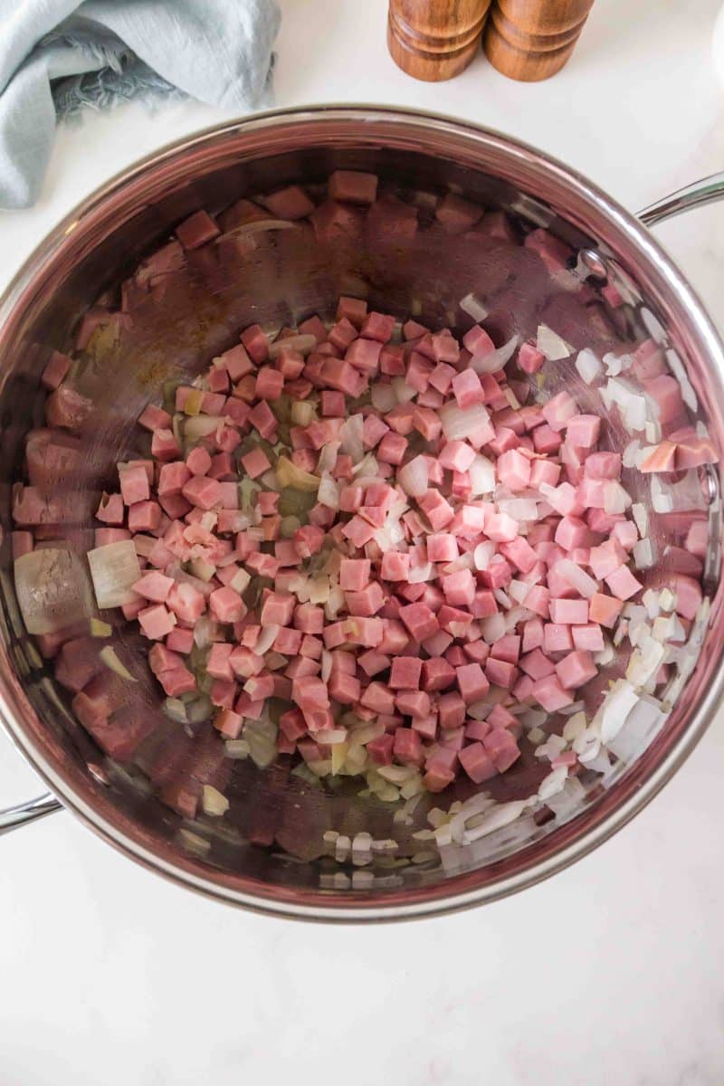 Diced onions and diced ham in a large pot. Hostess At Heart