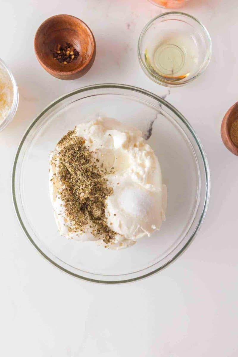 Mixing ricotta cheese with Italian seasoning in small bowl. Hostess At Heart