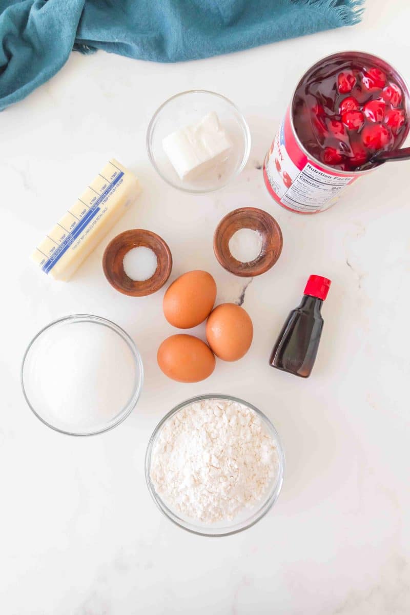 Cherry Pie Bars ingredients: sugar, flour, eggs, cherry pie filling, butter, shortening, baking powder, salt, and vanilla. Hostess At Heart