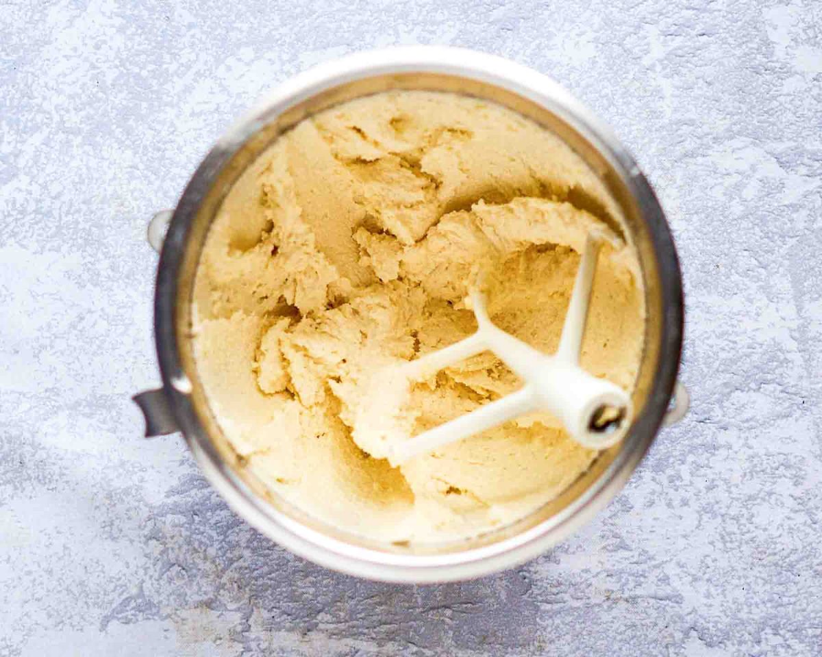 A mixing bowl filled with creamed butter and sugar. Hostess At Heart