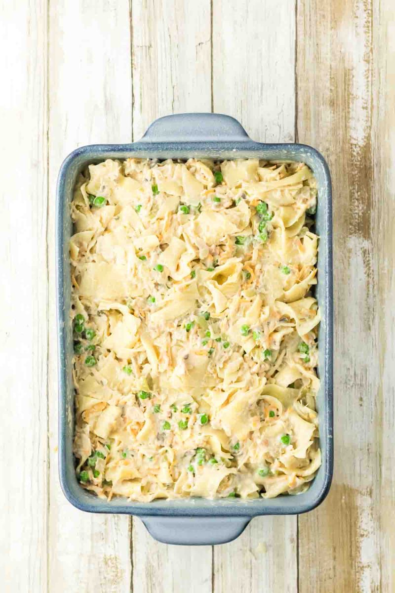 Top down view of a baking dish filled with an assembled tuna casserole easy before the topping is applied. Hostess At Heart