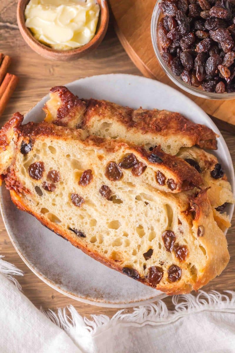 Thick slices of sourdough cinnamon raisin bread on a plate. Hostess At Heart