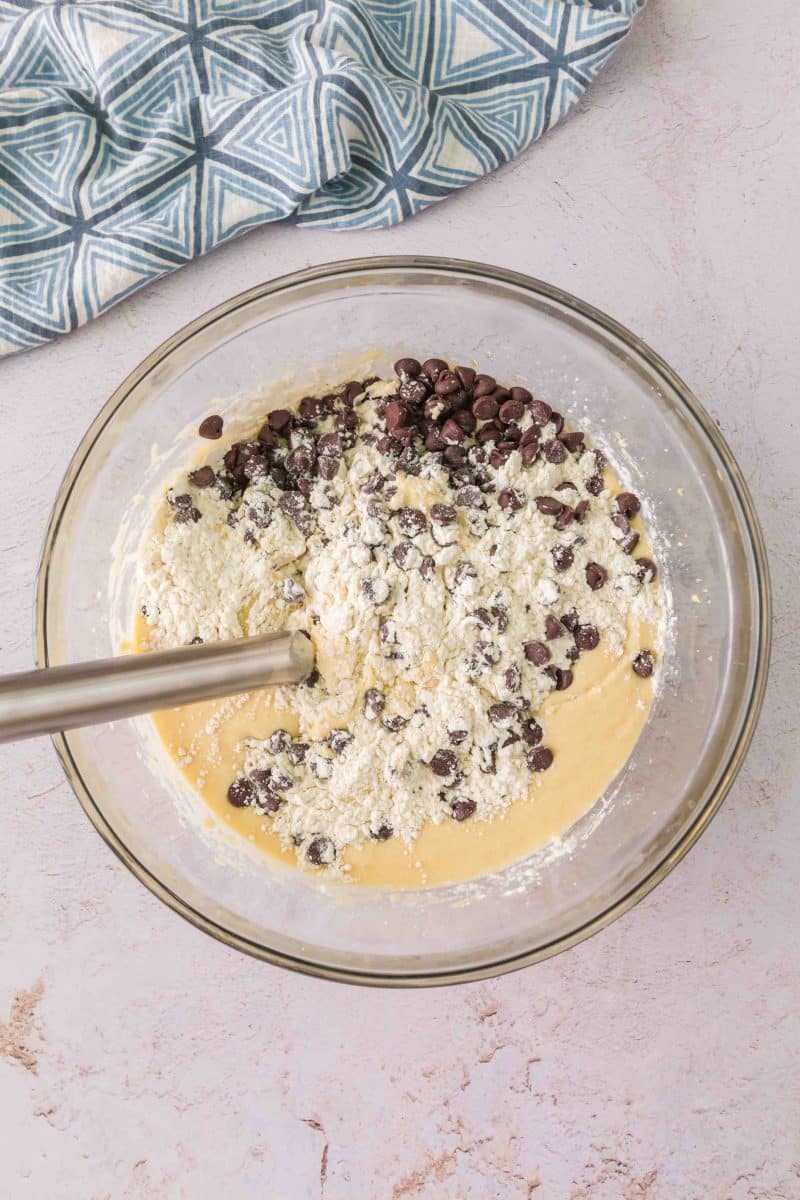 Dry ingredients and chocolate chips added to wet sourdough discard chocolate chip muffin batter. Hostess At Heart