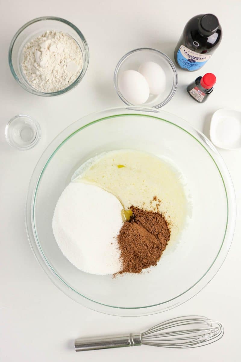 Melted butter, sugar, cocoa powder, and vanilla in a large mixing bowl. Hostess At Heart