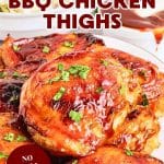 Titled image for Pinterest: Close up of juicy baked barbecue chicken thighs with sticky caramelized BBQ glaze. Hostess At Heart