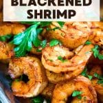 A silver serving platter filled with vibrant plump blackened shrimp garnished with fresh parsley. Hostess At Heart