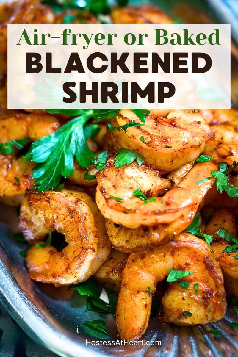 A silver serving platter filled with vibrant plump blackened shrimp garnished with fresh parsley. Hostess At Heart