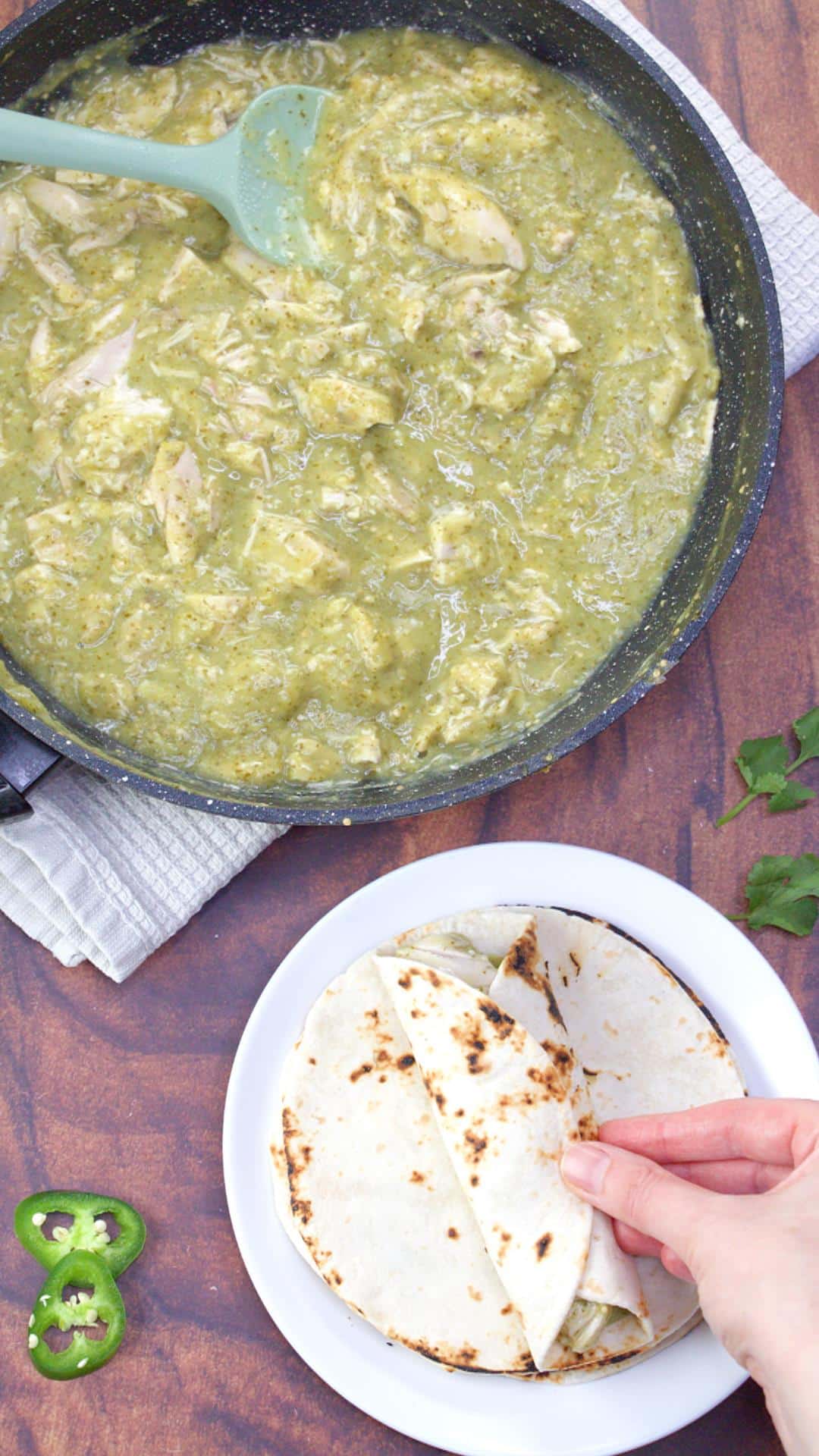 Warm corn tortillas filled with green mole chicken and rolled into enchiladas. Hostess At Heart