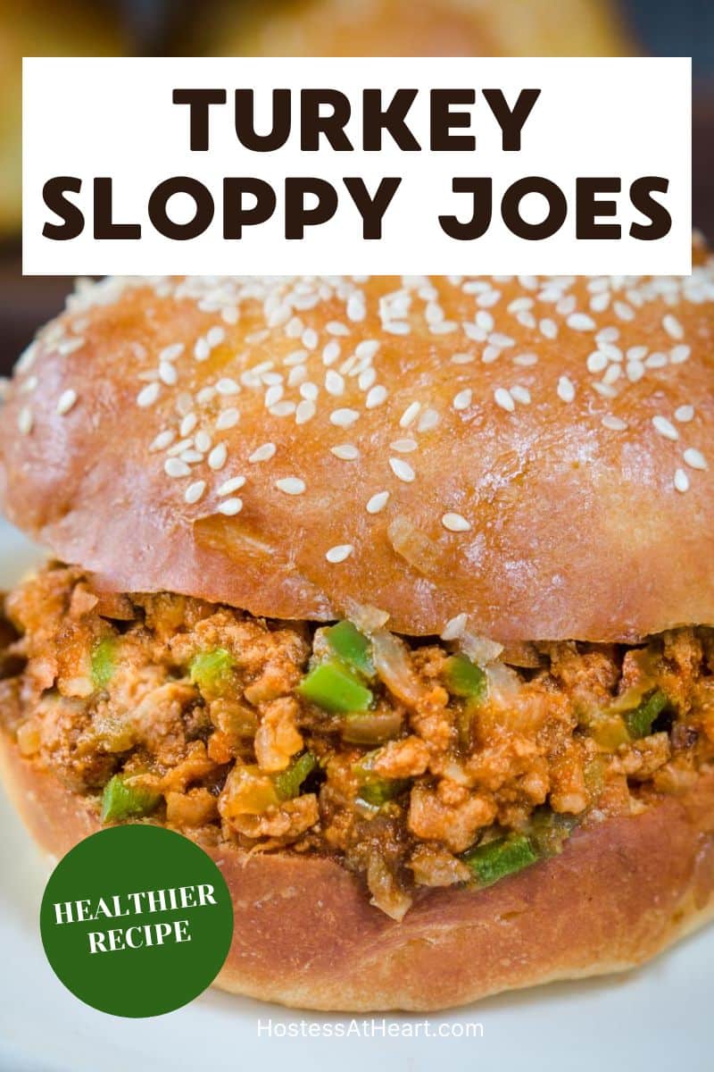A closeup view of a juicy sloppy joe sandwich make with ground turkey on a brioche bun. Hostess At Heart