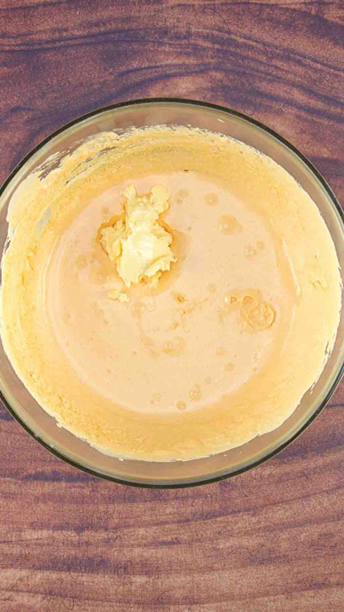 Combining whipped butter with fluffy egg yolks to make a hazelnut filling for a Esterhasy Torte Cake Recipe. Hostess At Heart