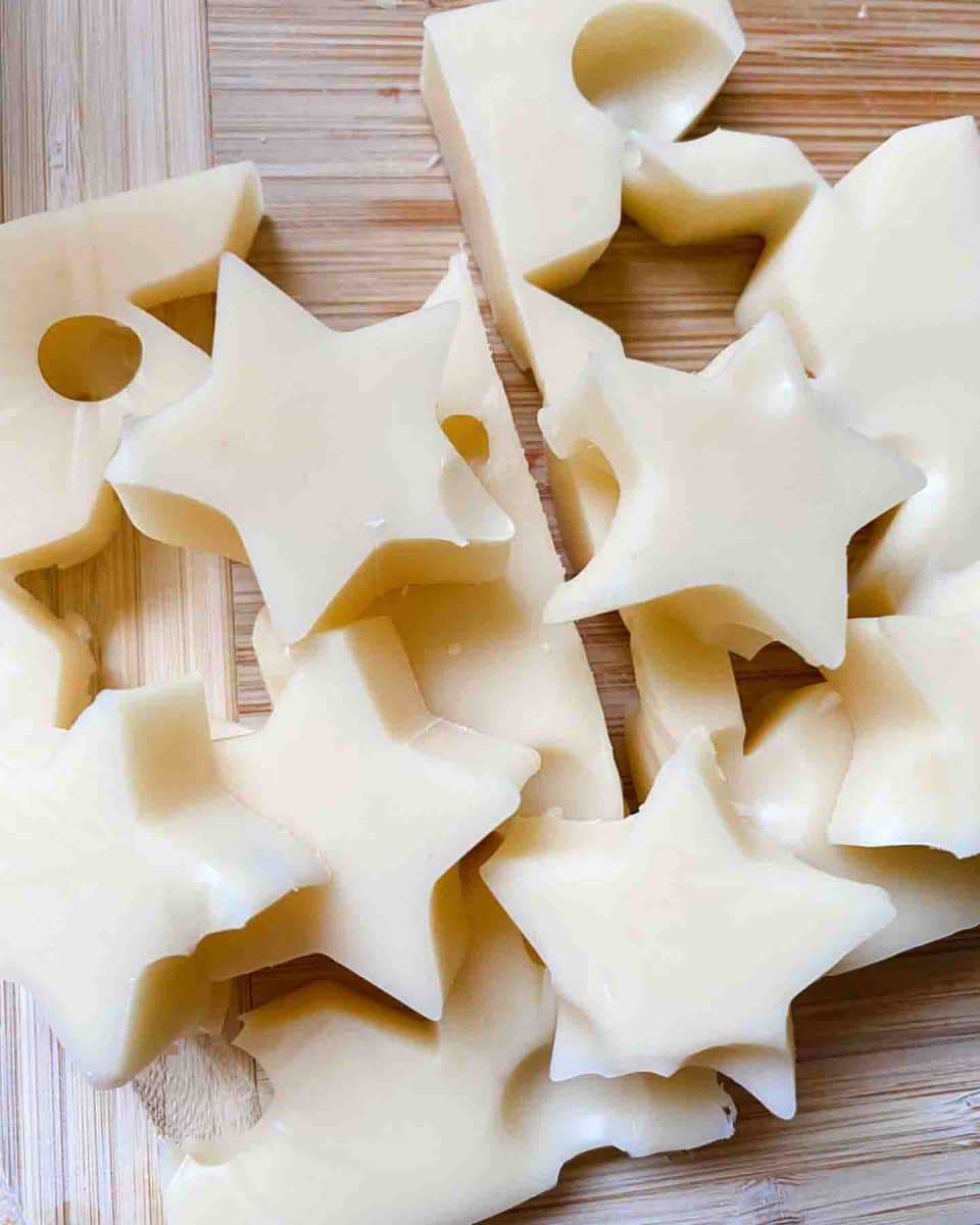 Top down view of white cheese stamped in the shape of stars for an easy patriotic appetizer. Hostess At Heart