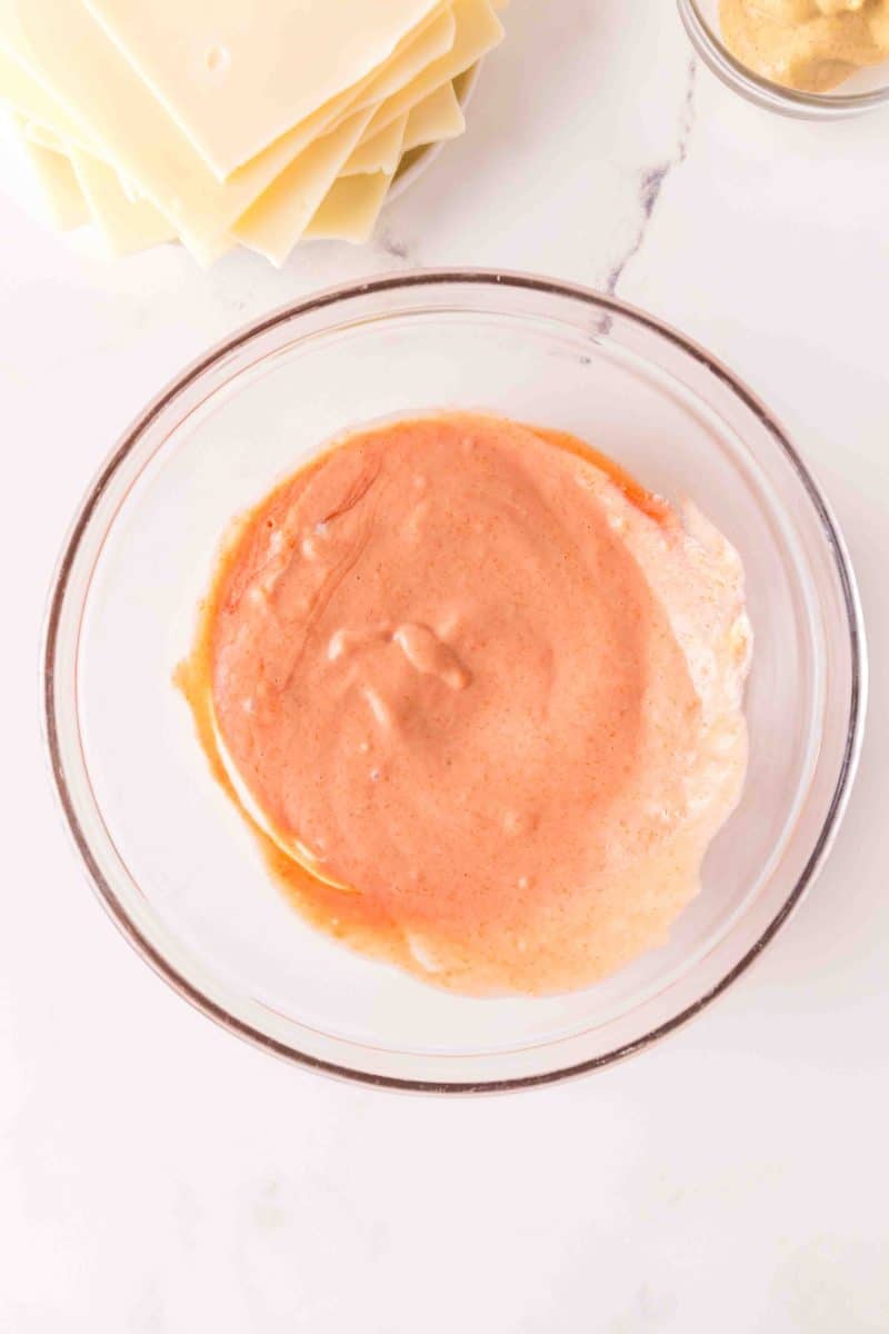 A bowl filled with creamy homemade thousand island dressing to make St. Patrick's Day Sliders. Hostess At Heart