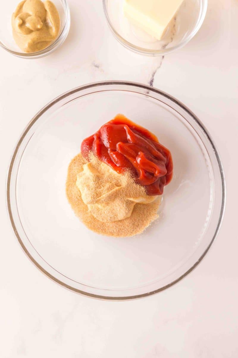 A bowl filled with the ingredients to make homemade thousand island dressing before it's mixed together for an easy corned beef sliders recipe. Hostess At Heart