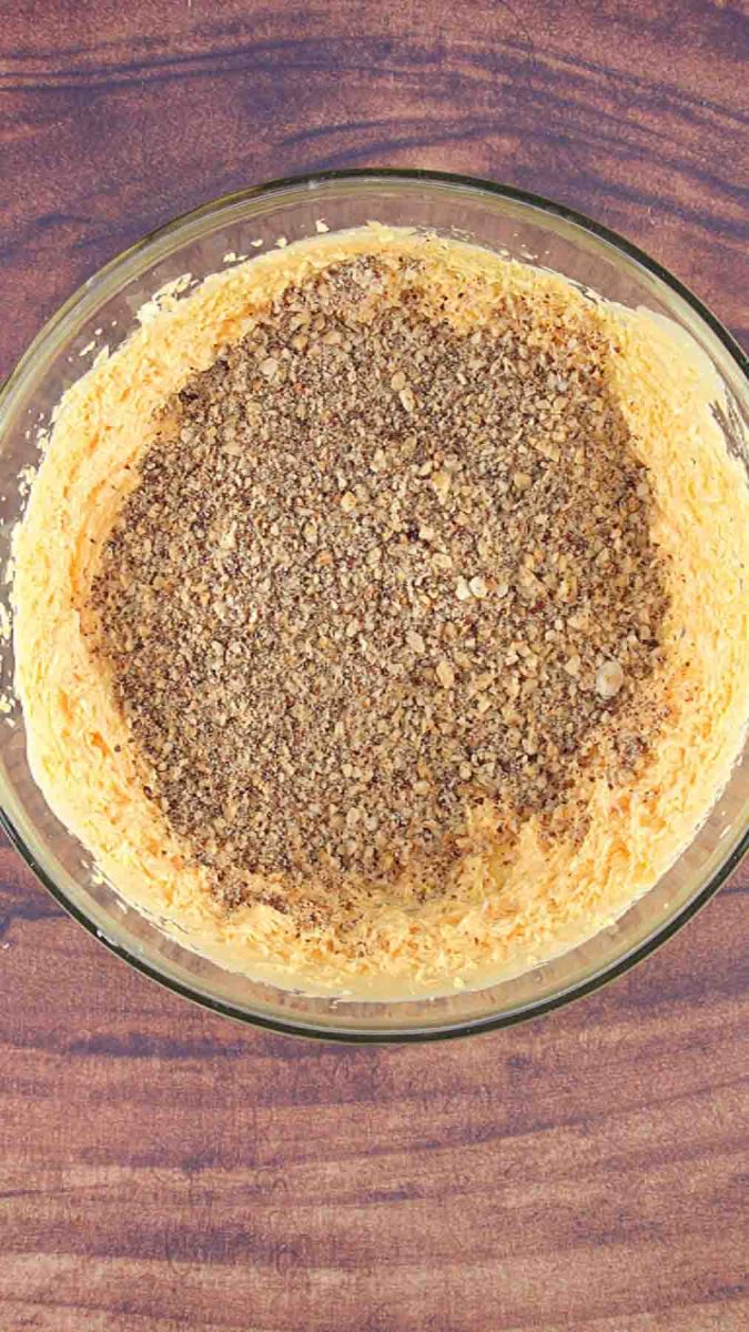 Cooked egg mixture topped with crushed hazelnuts to make a hazelnut filling for a hazelnut cake. Hostess At Heart