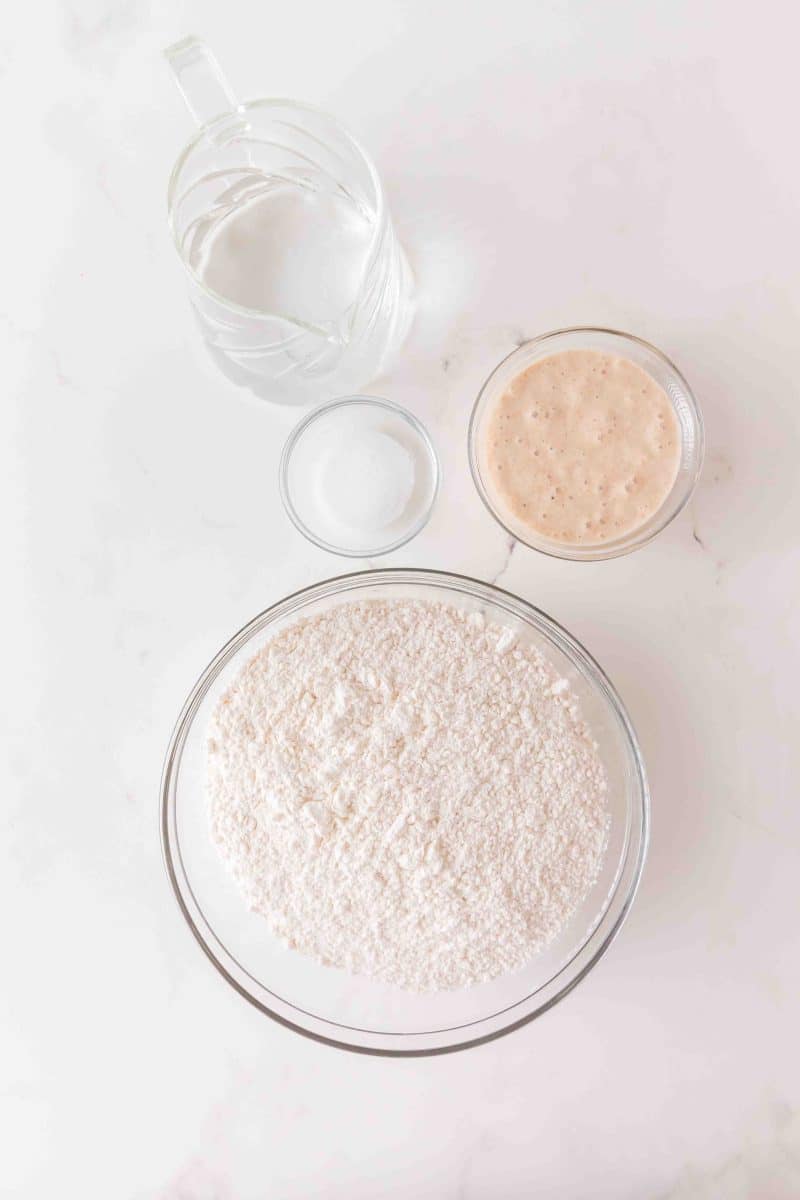 4 simple sourdough bread ingredients including: bubbly activated starter, flour, water, and salt. Hostess At Heart