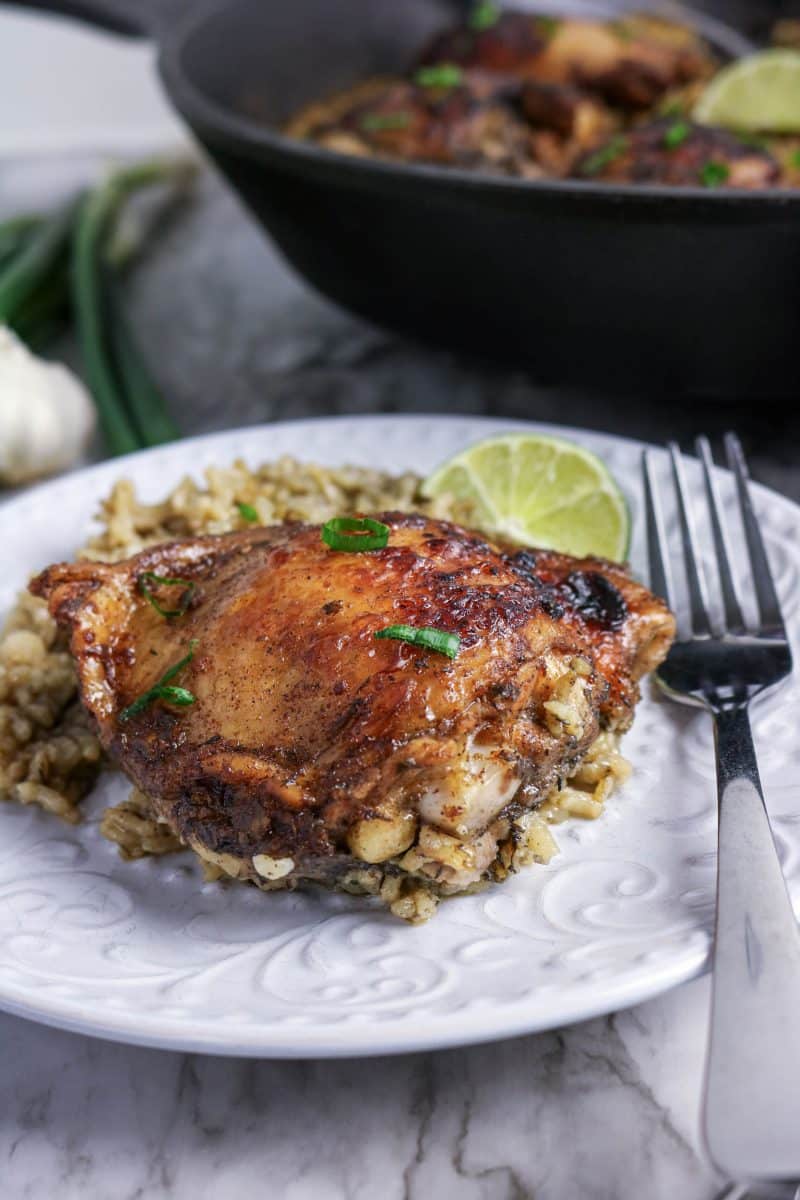 Crispy baked jerk chicken thigh on coconut milk rice with smoky seasoning. Hostess At Heart