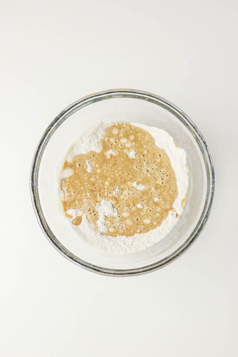 Wet coffee donut ingredients being added to dry doughnut recipe ingredients in a mixing bowl. Hostess At Heart