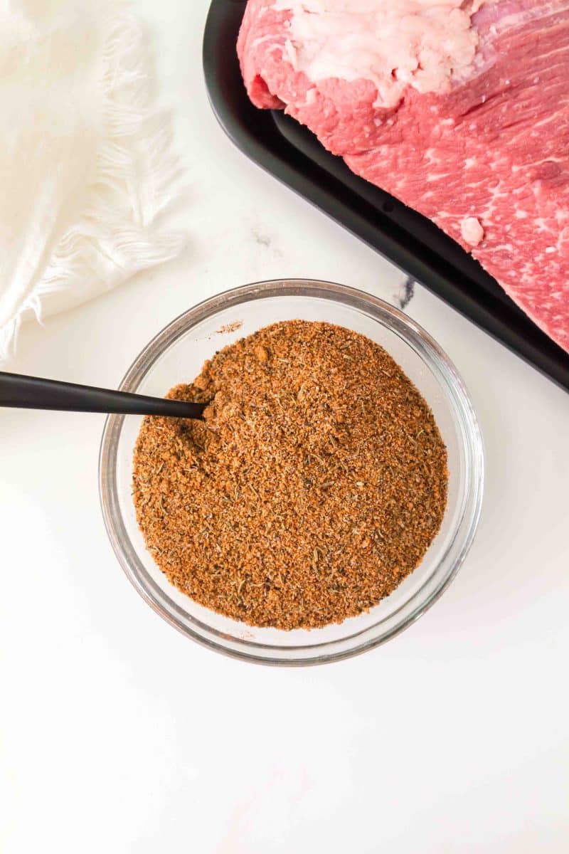 A bowl filled with a dry rub mix recipe for baking briskets. Hostess At Heart