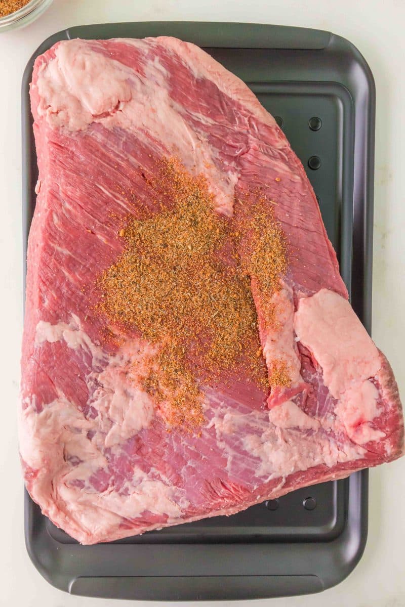 Dry Rub Spices sprinkled over a beef brisket. Hostess At Heart