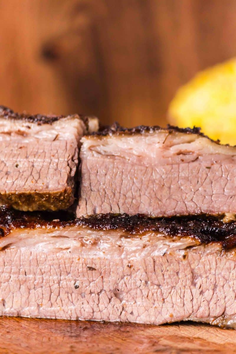 Two juicy slices of oven baked brisket stacked on top of each other. Hostess At Heart