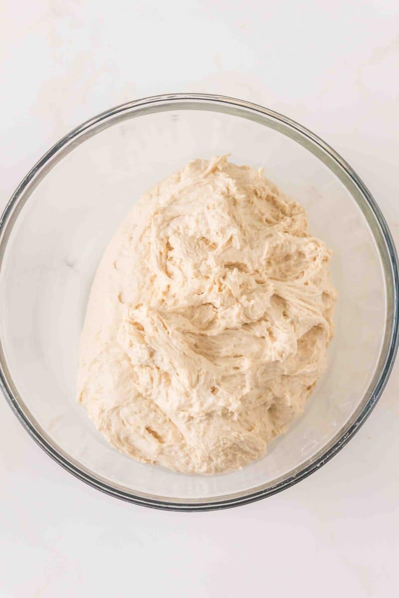A mixing bowl filled with a simple bread dough recipe mixed and ready for the first rise. Hostess At Heart