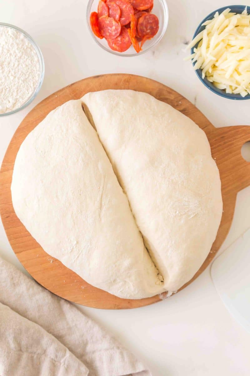 Proofed no knead dough cut in half to make two pizza crusts. Hostess At Heart
