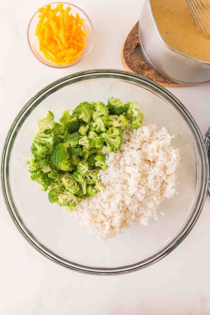 Broccoli florets and cooked rice in a large mixing bowl. Hostess At Heart