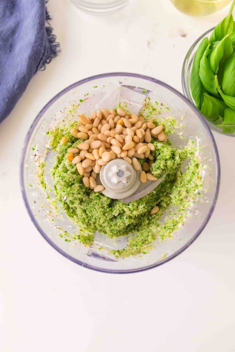 Pine nuts added to broccoli pesto in a food processor. Hostess At Heart