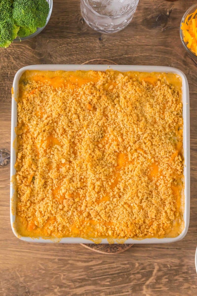 Overhead view of golden baked broccoli rice casserole with cream of mushroom soup fresh out of the oven. Hostess At Heart