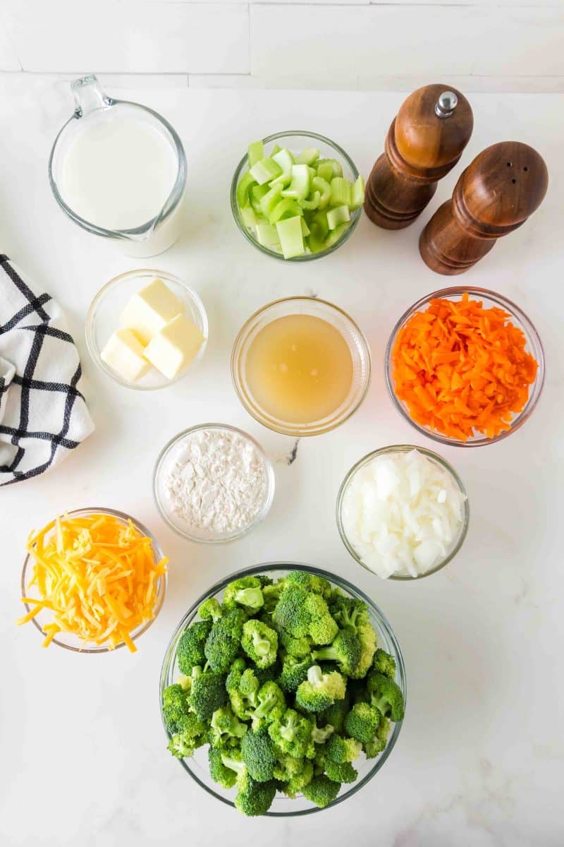 Broccoli cheddar soup ingredients including broccoli, carrots, celery, onion, cheddar, milk, flour, and butter. Hostess At Heart