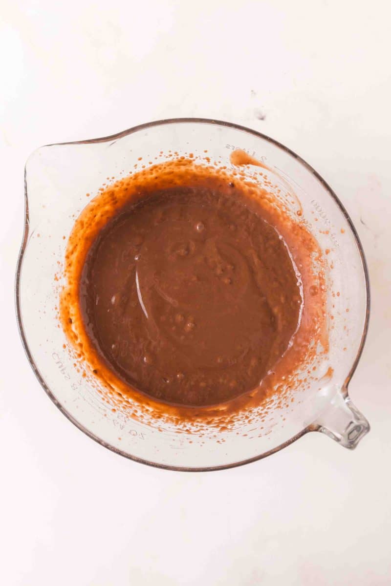 A large mixing bowl filled with thick chocolate pudding to make a layered chocolate pudding cake. Hostess At Heart