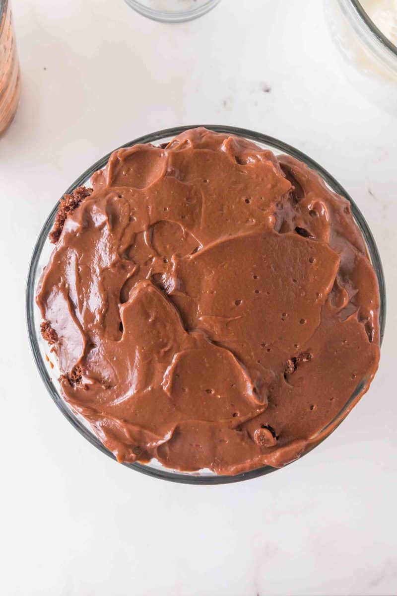 Chocolate pudding layer spread over the top of layers of chocolate cake, whipped topping, and cookie crumbs to make a trifle pudding chocolate. Hostess At Heart