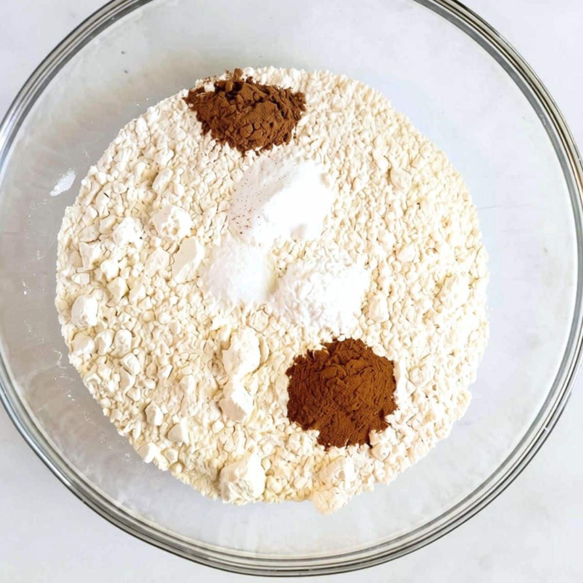 Dry ingredients combined together in a bowl for chocolate pumpkin muffins. Hostess At Heart