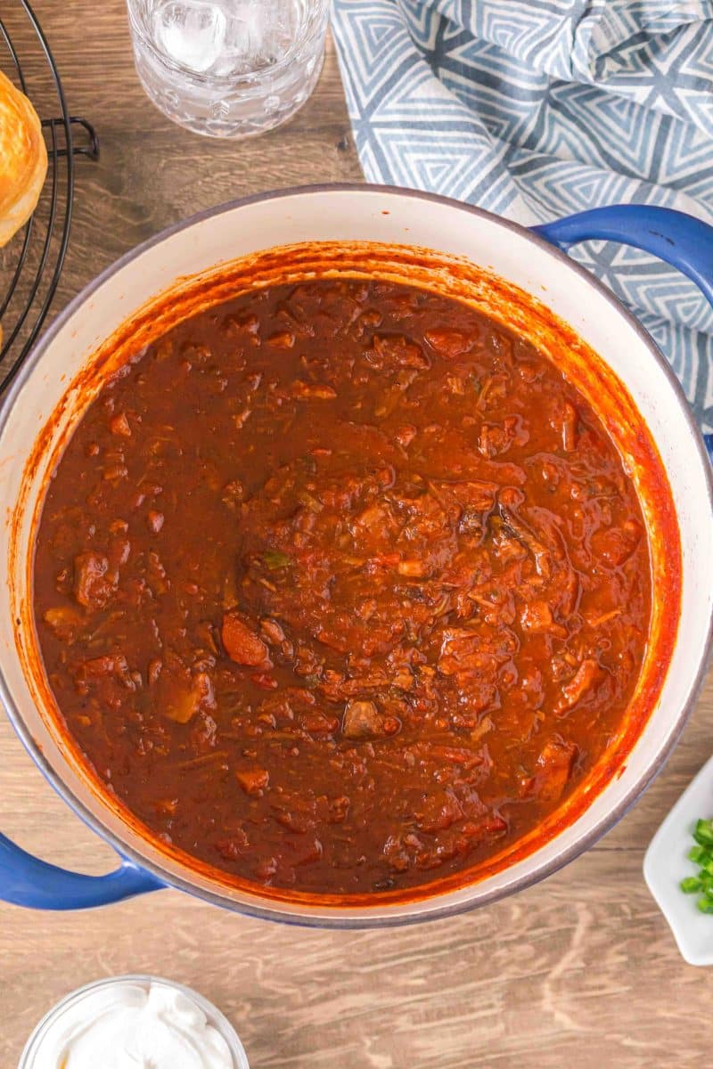 Brisket chili recipe ingredients in a Dutch oven ready to be simmered. Hostess At Heart