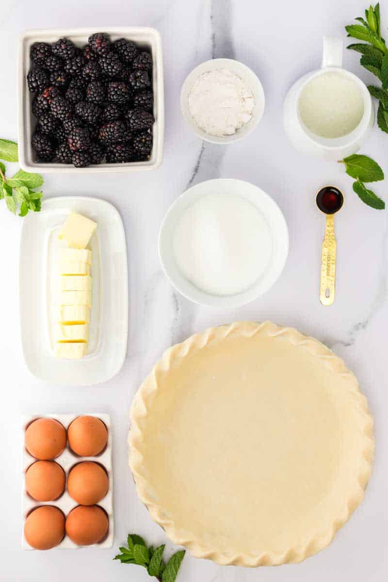 Buttermilk Pie Recipe Ingredients: Pie plate with an unbaked pie crust, eggs, butter, buttermilk, sugar, vanilla, and flour. Hostess At Heart
