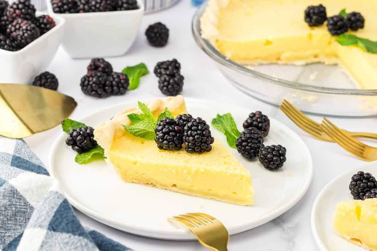 Buttermilk pie recipe with creamy vanilla custard filling and fresh blackberries. Hostess At Heart