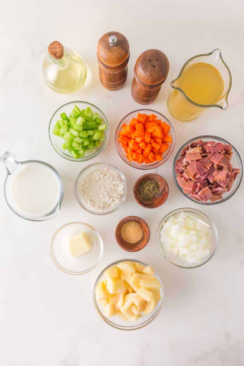 Ham potato soup ingredients including diced ham, potatoes, carrots, celery and onion, chicken broth, butter, leftover ham, milk, flour. Hostess At Heart