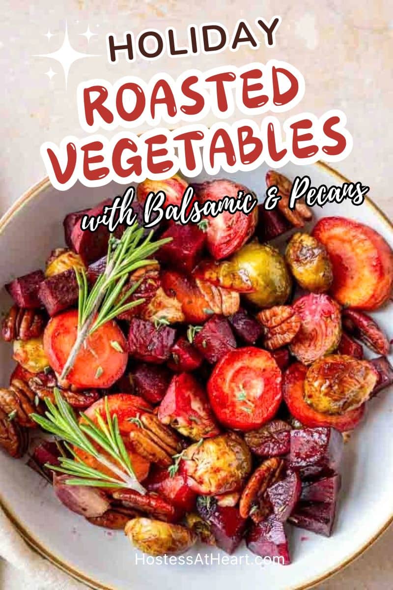 Image for Pinterest of honey roasted carrots, beets, and Brussels sprouts with pecans in a serving dish, topped with pecans and herbs. Hostess At Heart