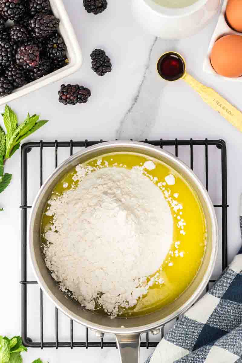 Melted butter mixed with flour and sugar in a saucepan. Hostess At Heart