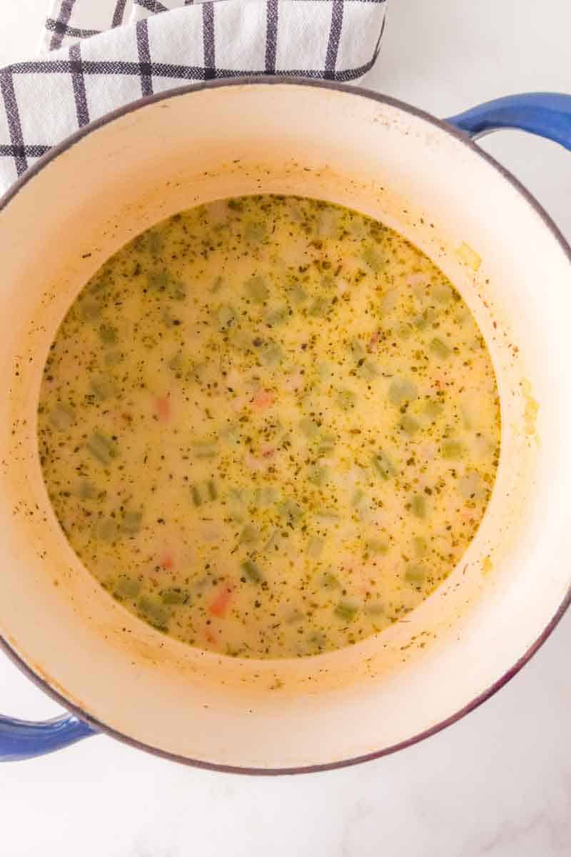 A smooth milk roux used to thicken ham and potato soup added to a Dutch oven. Hostess At Heart