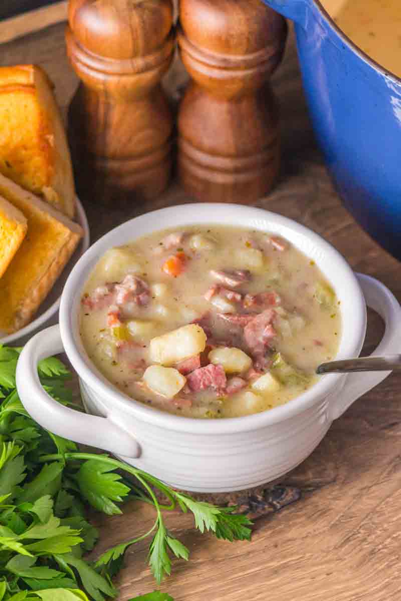 Bowl of creamy ham and potato soup with tender vegetables. Hostess At Heart