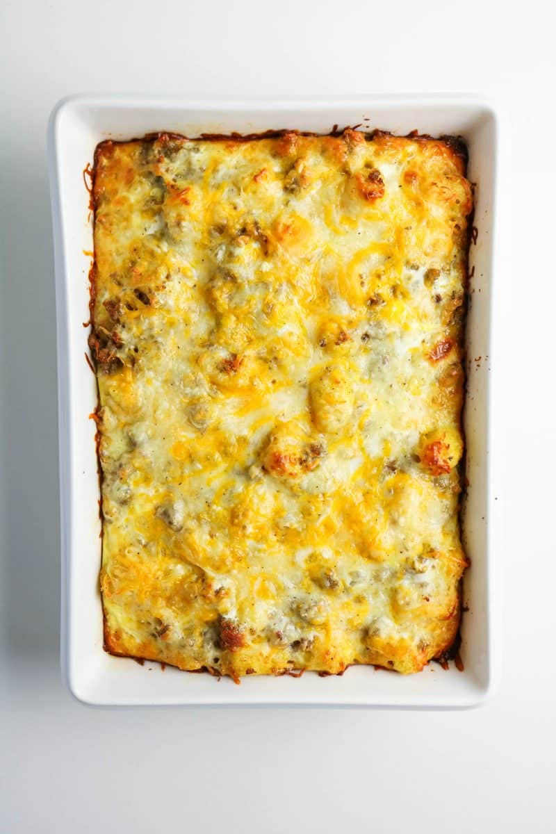 Baked breakfast casserole with golden brown melted cheese. Hostess At Heart