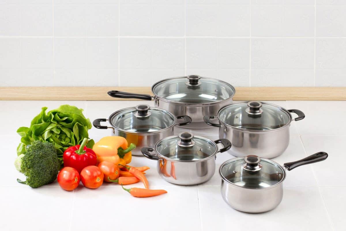 Gift guide graphic showing favorite pots and pans for home cooks. Hostess At Heart